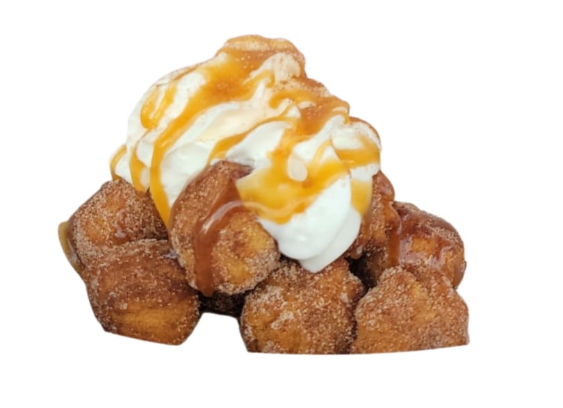 More Than Pudding's cinnamon sugar donut holes topped with whipped cream and caramel drizzle.